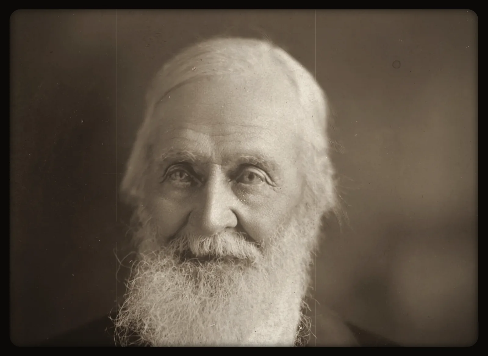 An archive portrait from about 1900, projected through a film gate.